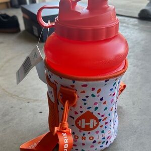 HydroJug Vibrant Red Bottle with Colorful Orange Sleeve